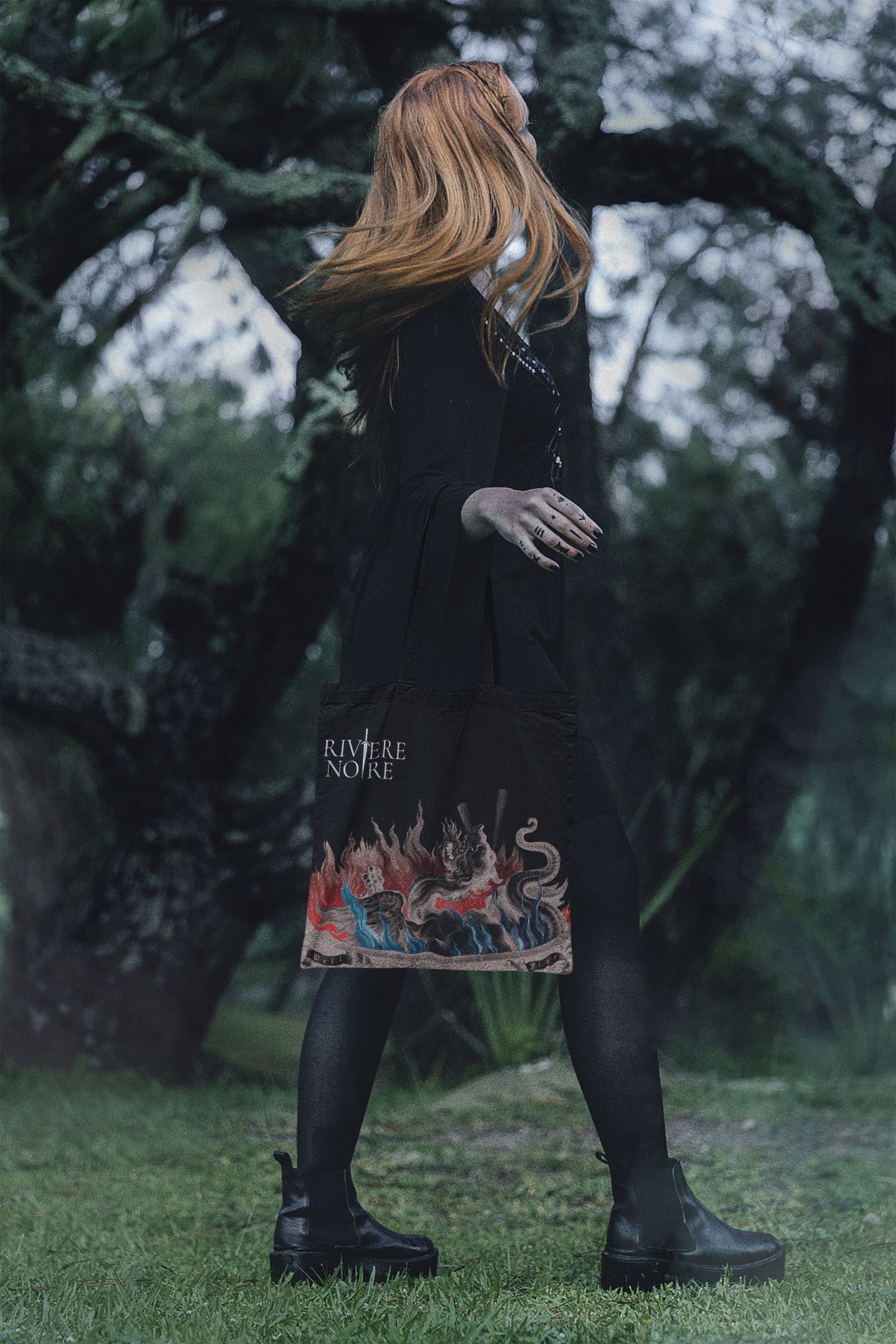 Lady walking with black tote bag Cauldron Containing a Monster art printed on black tote bag